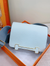 Airy Mist Blue Compact Square Box Flap Carry Bag With Distinctive H-Shaped Golden Lock Fixture And Wide Woven Fabric Strap