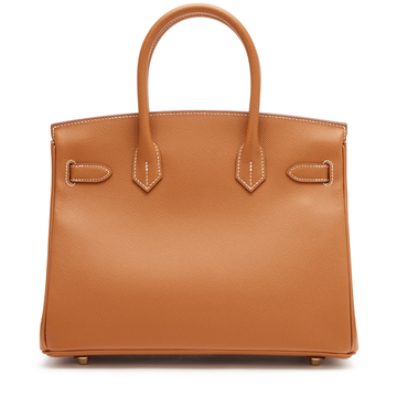 Warm Golden Tan Fine Grain Structured Trapezoid Hand Tote With Glossy Luminous Golden Lock Hardware And Contrast Pale Edge Stitching